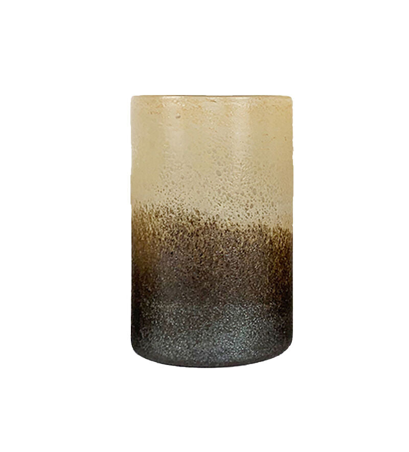 Tall cylindrical candle with gradient color from beige to brown on a white background