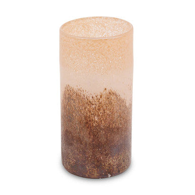 Cylindrical candle with gradient color from beige to brown on a white background