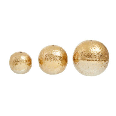 Three gold spherical objects on a white background