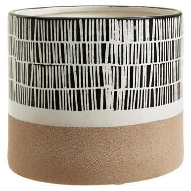 Cylindrical ceramic planter with black and white pattern and beige base
