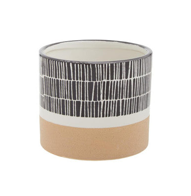 Ceramic pot with black and white pattern on a beige base