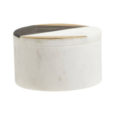 Round white container with black top on a white background