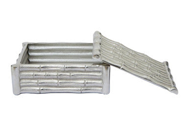 White woven rectangular box with lid on a white background