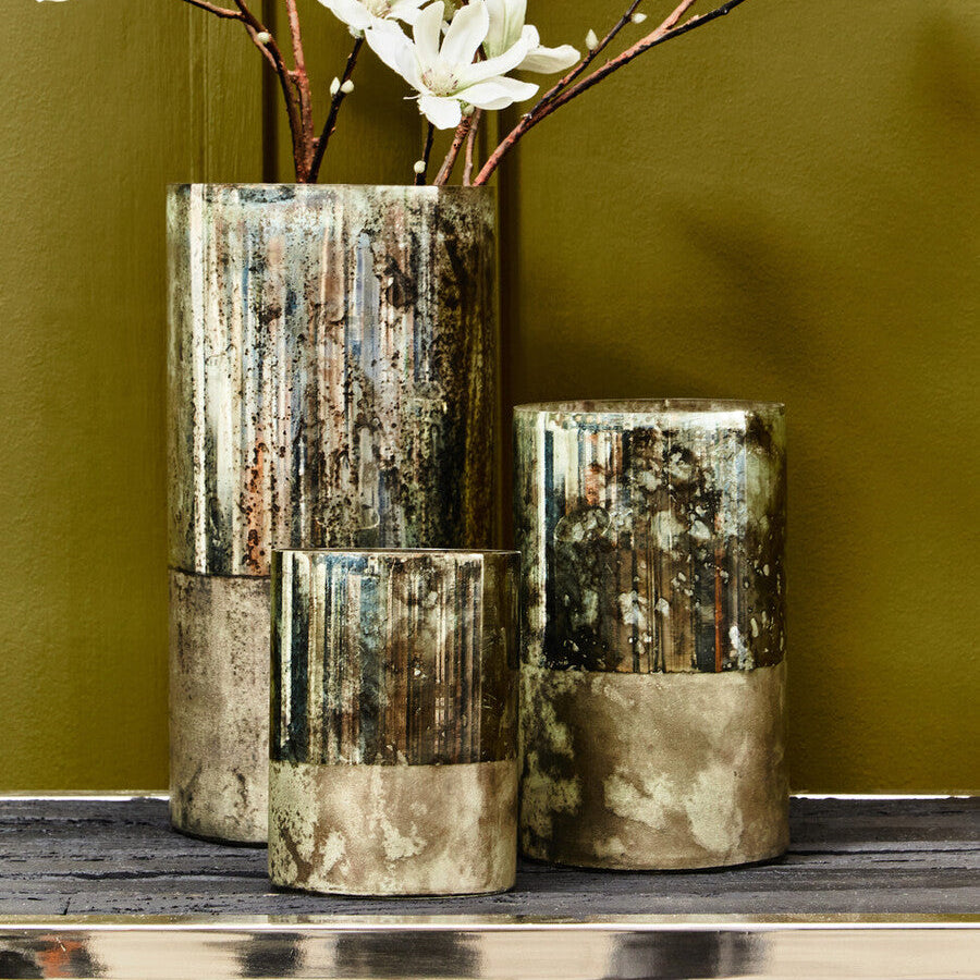 Two decorative vases with a textured, multicolored finish on a green background.