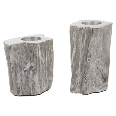 Two gray stone candle holders on a white background