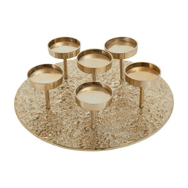 Gold candle holder with six small candles on a textured round base