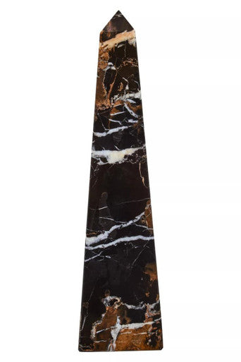 Marble obelisk with black, white, and brown patterns on a white background