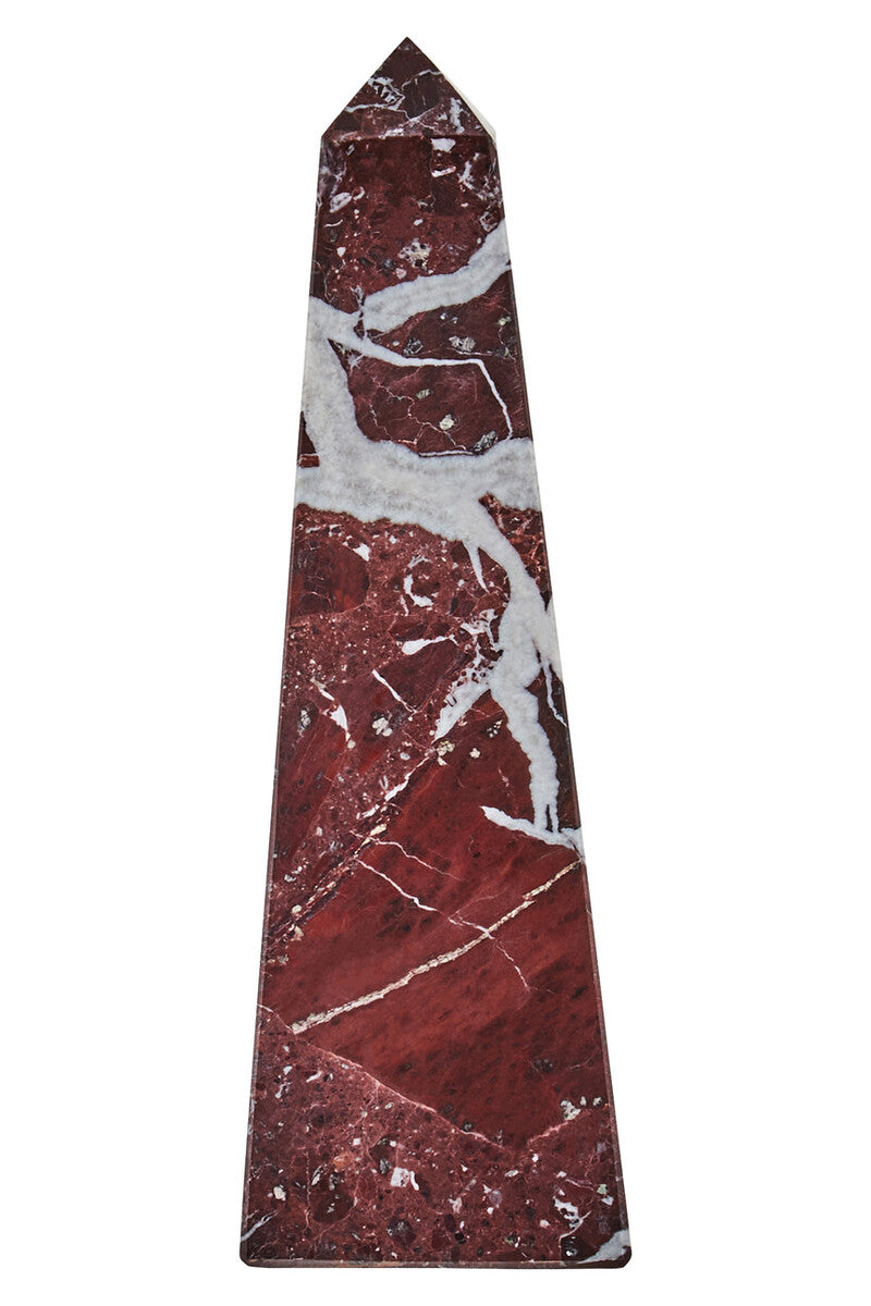 Marble obelisk with red and white patterns on a white background