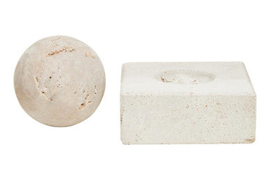 Two beige bath bombs on a white background