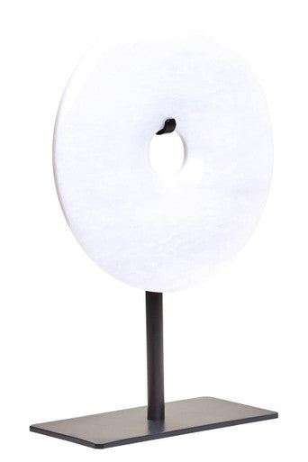 Modern table lamp with a round white shade and black base on a white background