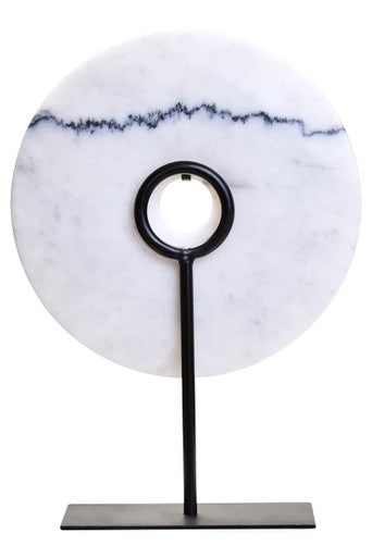 Decorative item with marble base and black stand on a white background