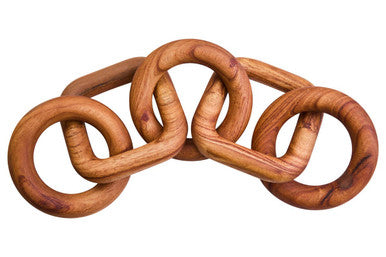 Wooden interlocking rings on a white background