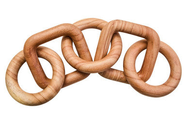 Wooden interlocking rings on a white background