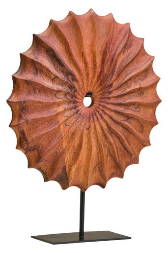 Decorative wooden umbrella on a stand against a white background
