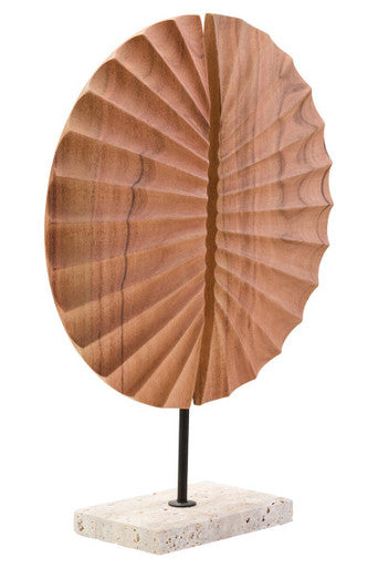 Wooden sculpture with a circular design on a white background