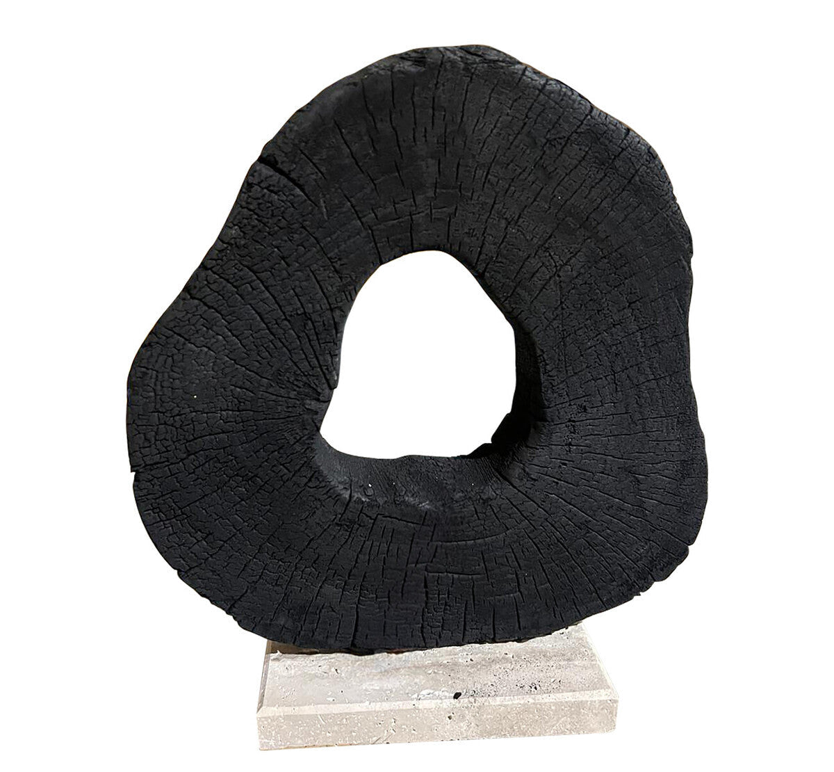 Black circular sculpture on a white background