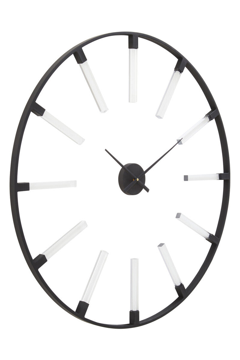 Decorative wall clock with black rim and white accents on a white background