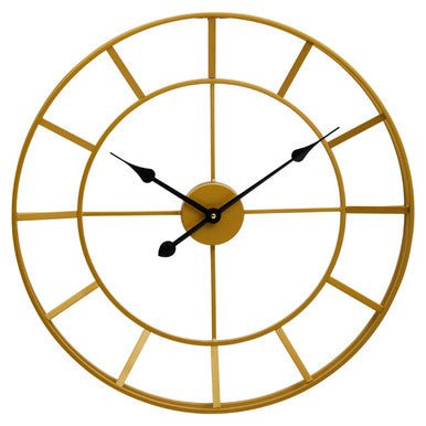 Gold wall clock with black hands on a white background