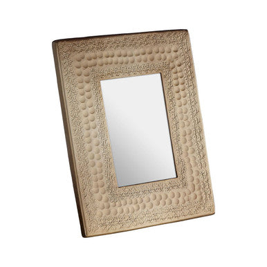 Decorative rectangular mirror with textured frame on a white background