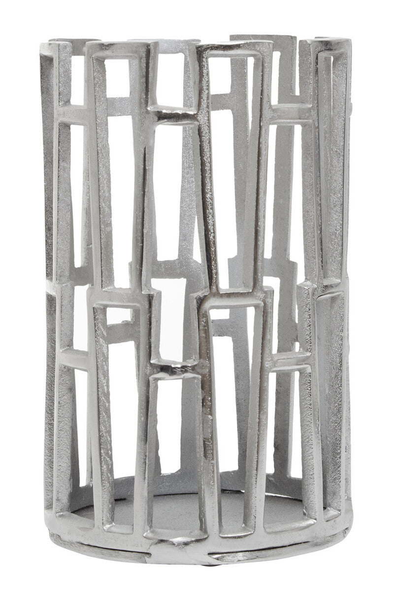 Decorative metallic candle holder with geometric design on a white background
