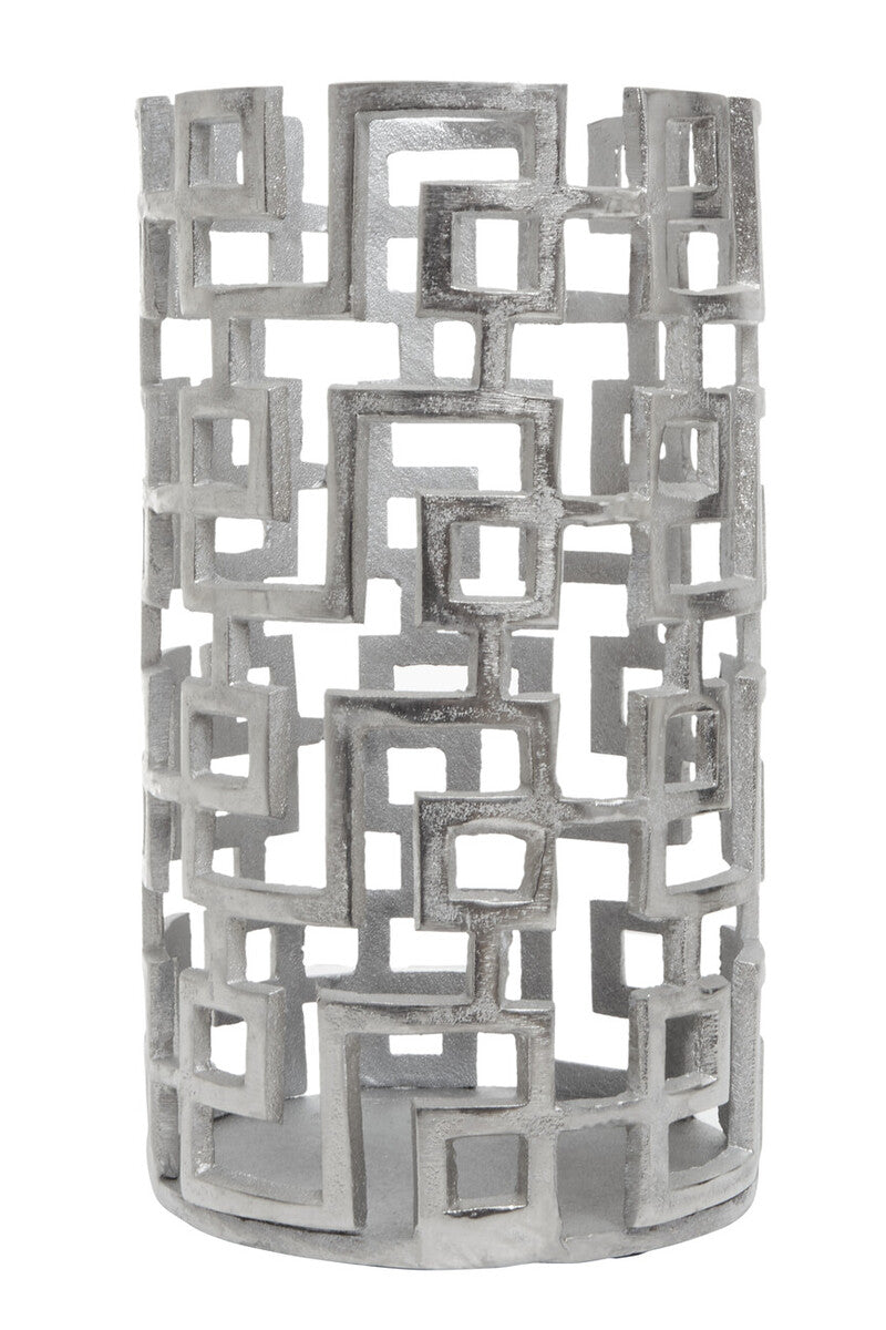 Decorative candle holder with geometric pattern on a white background