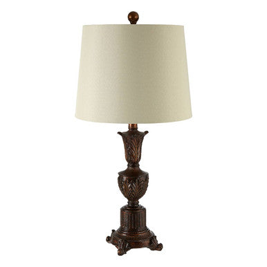 Decorative table lamp with a brown base and white shade on a white background