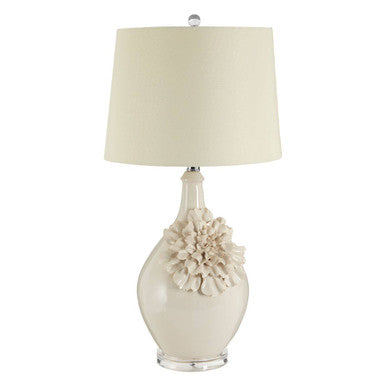 Decorative table lamp with floral design on a white background