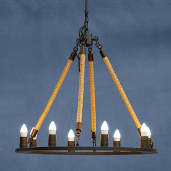 Chandelier with yellow ropes and lit bulbs against a blue background