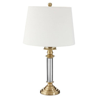 Table lamp with white shade and gold base on a white background