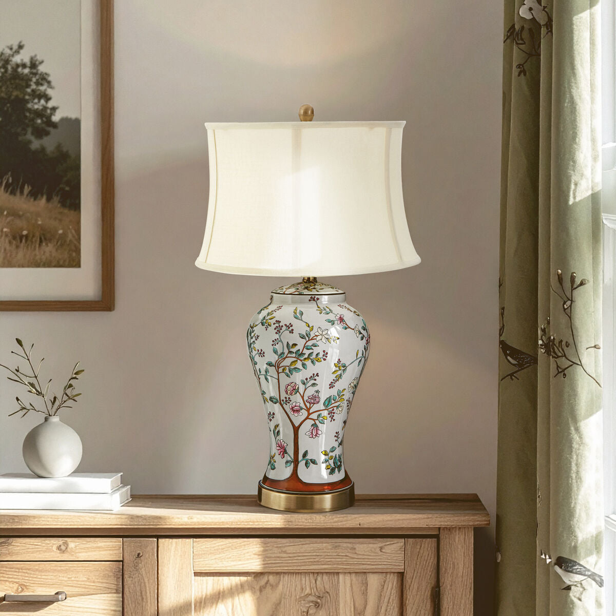 Decorative table lamp with floral design on a wooden cabinet