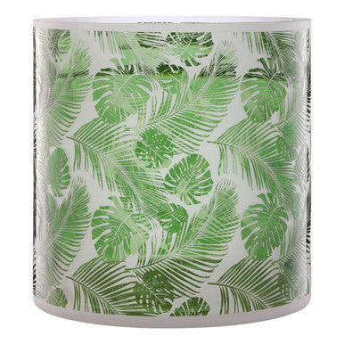 Glass candle holder with green leaf pattern on a white background