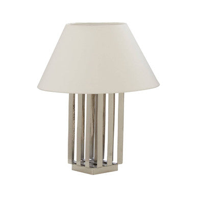 Table lamp with a white shade and metallic base on a white background