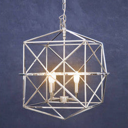 Geometric pendant light fixture on a dark blue background