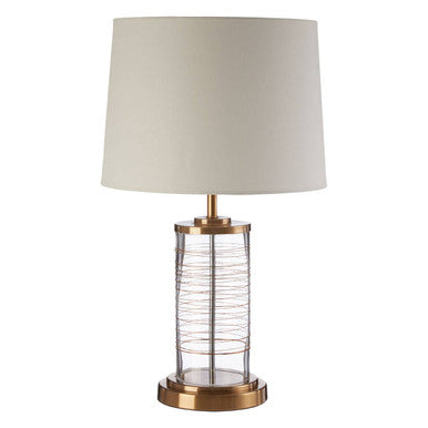 Table lamp with a beige shade and metallic base on a white background