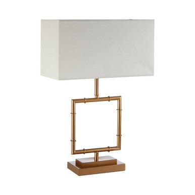 Table lamp with gold frame and white shade on a white background