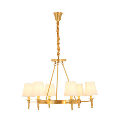 Gold chandelier with white lampshades on a white background
