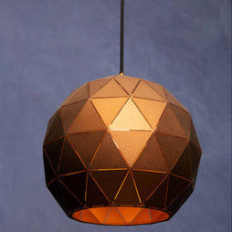 Geometric pendant light with a metallic finish on a plain background