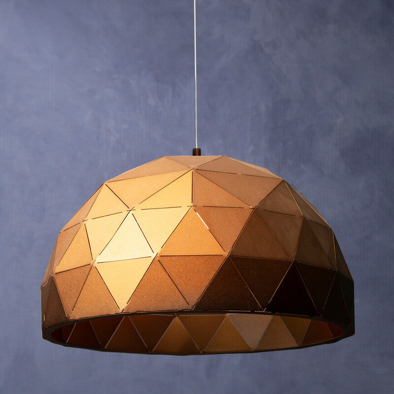 Geometric pendant light with a metallic finish on a dark background