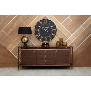 Wooden sideboard with decorative items against a tiled wall
