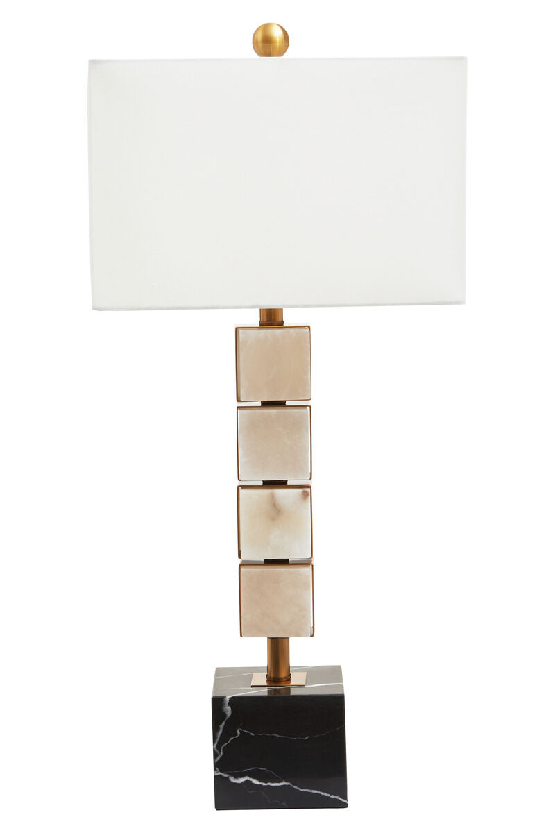 Decorative table lamp with marble base and gold accents on a white background