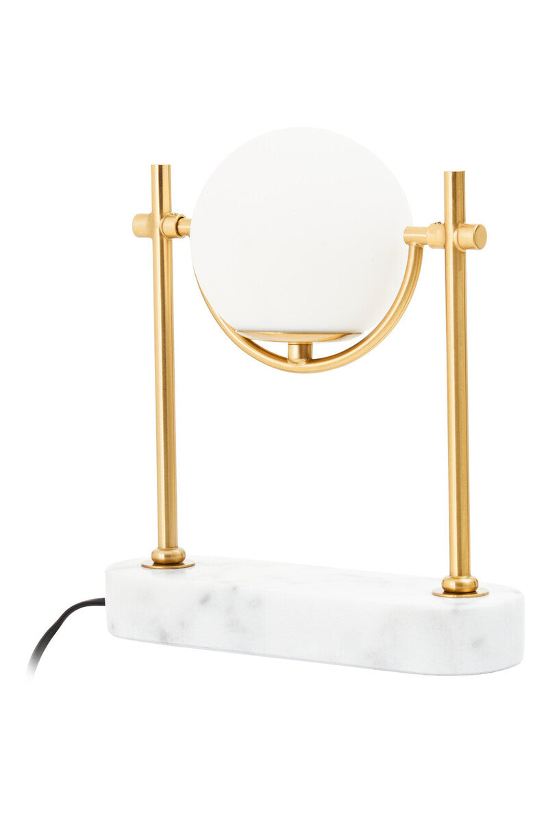 Table lamp with marble base and gold accents on a white background