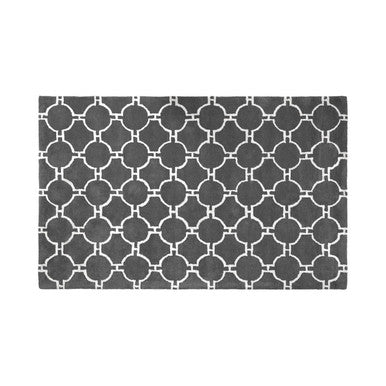 Patterned doormat with geometric design on a white background