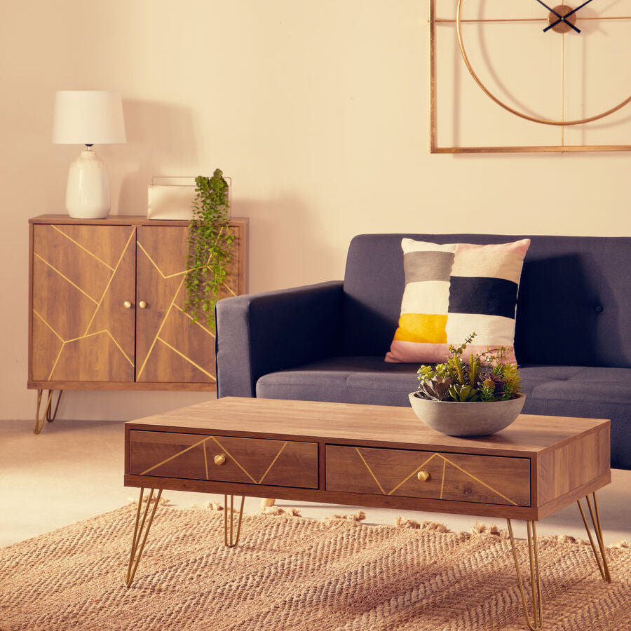Modern living room with a wooden coffee table, blue sofa, and decorative items.