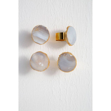 Set of four agate-style knobs with gold accents on a white background