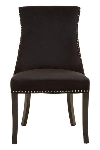 Black upholstered chair with nailhead trim on a white background