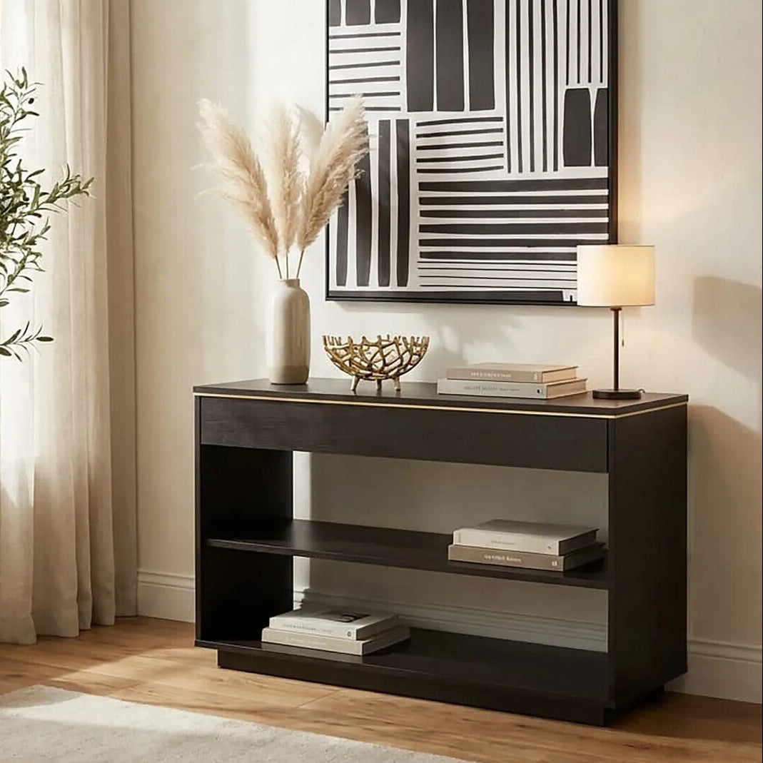 Dark wood console table with decorative items in a living room setting.