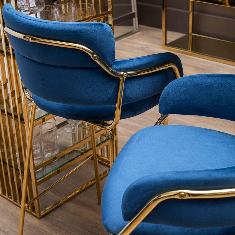 Blue chairs with gold frames in a modern interior setting