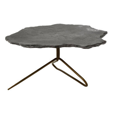 Table with a natural stone top and metal legs on a white background
