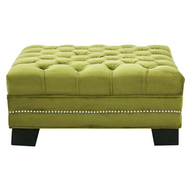 Green tufted ottoman with nailhead trim on a white background
