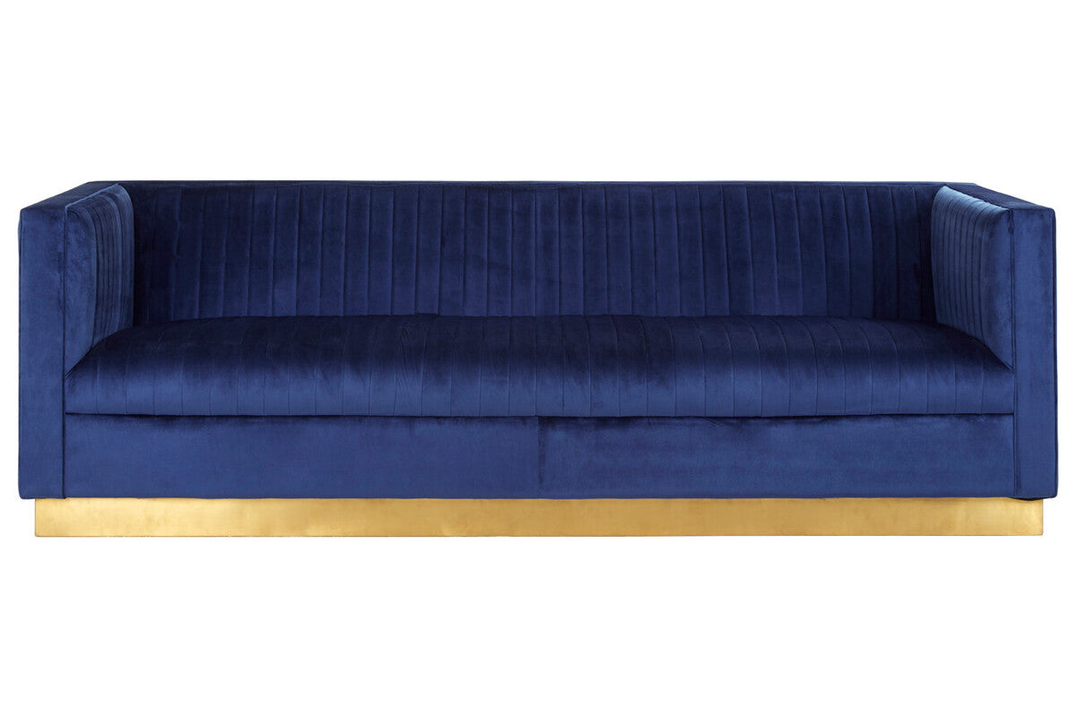 Blue velvet sofa with a gold base on a white background